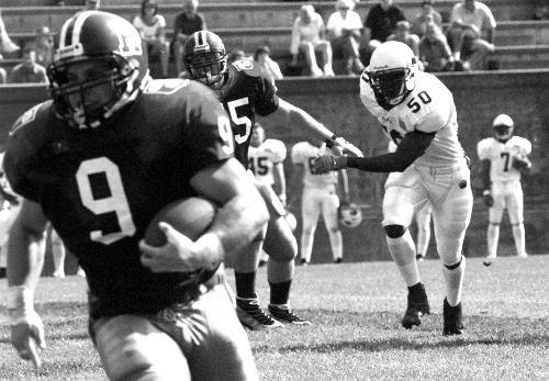 Crimson tailback JOSH STAPH (9) turned in an impressive performance on Saturday, rushing for 152 yards and three touchdowns against the Bears. Harvard defeated Brown, 27-20, at The Stadium.