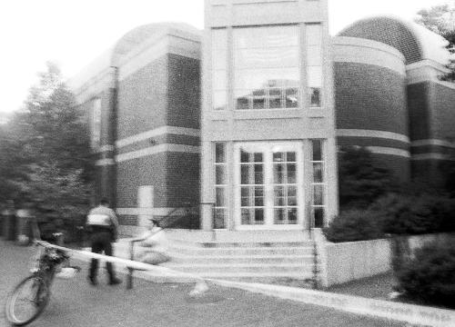 Police tape surrounds Rosovsky Hall yesterday. The building was evacuated and decontaminated following an anthrax scare.