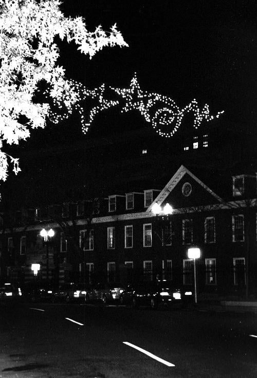 Holiday lights adorn the Cambridge sky on Mass. Ave outside of Wigglesworth Hall. Winter break begins for Harvard students on Dec. 14.