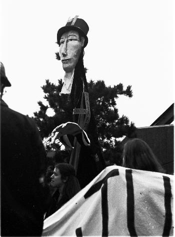 A puppet labeled "Harvard Corporation Member" travels in a procession organized by the Progressive Student Labor Movement. The Friday afternoon rally was attended by students and workers.