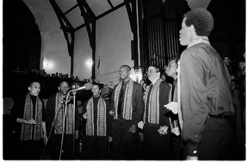 Members of the Kuumba Singers sing in their 31st annual Christmas concert, titled “Out of the Storm” to a packed house in Memorial Church on Friday night.