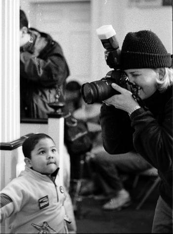 MANUEL MARTINEZ, 3, inspects the heavy media presence at Monday's Justice For Janitors rally.
