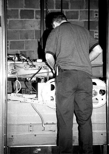 A worker fixes one of New Quincy’s elevators, which has been prone to failure. The repairs are expected to be complete within a week.