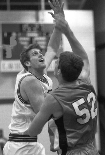 Tim Coleman plays in last Saturday's men's basketball game.