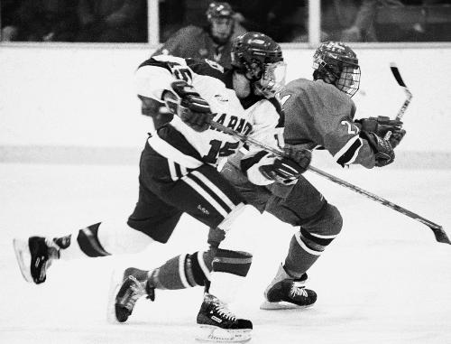 Harvard's BRETT NOWAK skates against RPI this weekend.