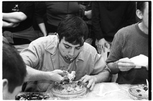 AARON R. PARSONS '02 eats his way to second place in the 'Pi Day' pie-eating contest held in the Science Cetner. The contest was a part of the arger celebration of the day, which also included a pi recitation contest.