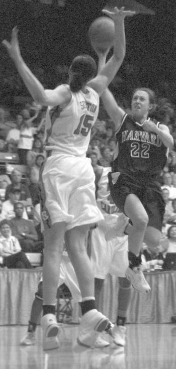 Harvard sophomore DIRKJE DUNHAM (R) cringes as her shot is about to be blocked by 6’6 Tar Heel center CANDACE SUTTON. 