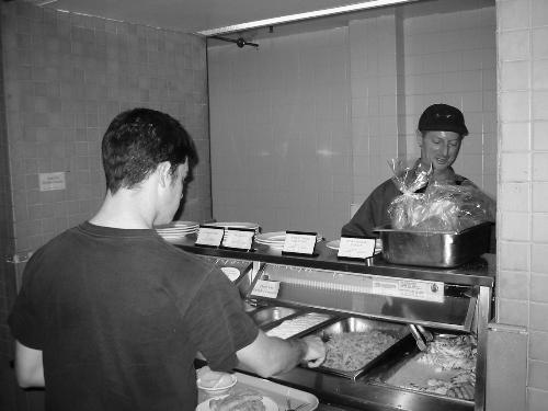 A student helps himself to a meal at Cabot House yesterday. This spring fruit flies have infested the Cabot dining hall, taking advantage of what Harvard’s pest-control office says was a “compost-like situation.”