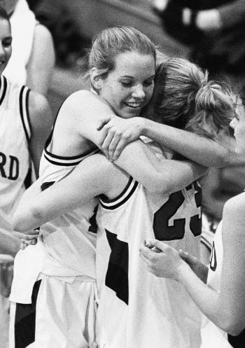Senior LINDSAY RYBA (L) of the Harvard women’s basketball team.