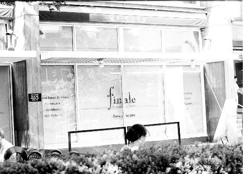 Large posters announcing the fall arrival of the dessert restaurant Finale fill the windows of the former location of Ma Soba behind the Holyoke Center. Still awaiting permits, Finale will open by September or October.