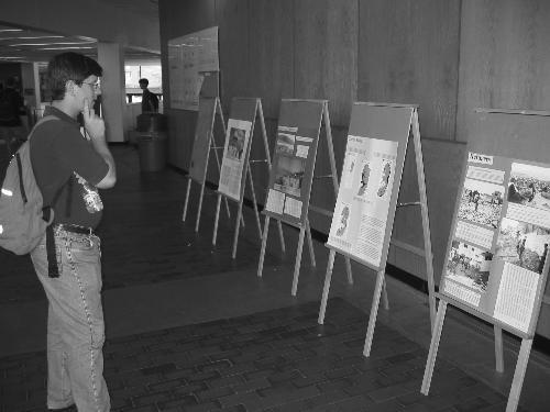 OLIVER A. LENNOX ’04 observes a controversial exhibit currently on display in the Science Center about the Intifada in the Middle East.