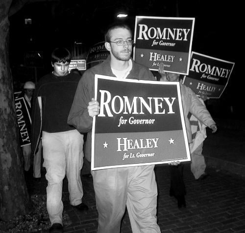 Supporters of candidates Mitt Romney (R) and Shannon P. O’Brien (D) march last night outside the final gubernatorial debate before next Tuesday’s election.  .