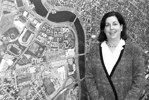   Associate Vice President for Planning and Real Estate KATHY A. SPIEGELMAN stands in front of a map of the University’s land in Allston.