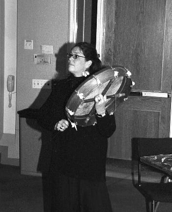 Kennedy School of Government mid-career fellow LUCY H. NESBEDA beats a hand drum at the beginning of her talk on shamanism yesterday, hoping that the sound would stir the spirits. 