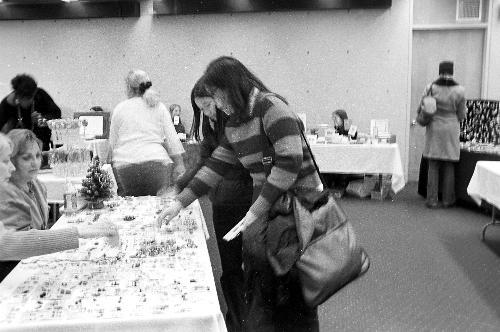 Kristen Hung ‘04 and Deborah Leong ‘04 examine local artisans’ wares yesterday at the Arts and Crafts Fair sponsored by the Gutman Library at the Graduate School of Education.