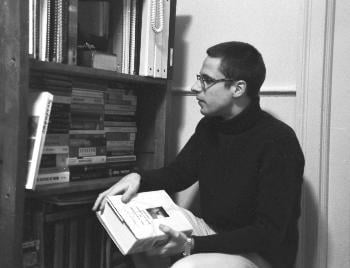 JURA PINTAR  ’05 in Lowell House with his award-winning collection of books on Marxist philosophy. He is entering again Harvard’s competition in undergraduate book collecting.