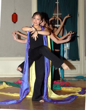 ANICA C. LAW ’06 dances with the Traditional Chinese Dance Troupe at Leverett Dining Hall Saturday night. 