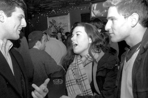 Seniors DAVID M. GLIKLICH (L), THOMASIN D. FRANKEN and JUSTIN A. ERLICH (R) talk during  Senior Bar night at the Hong Kong yesterday. 