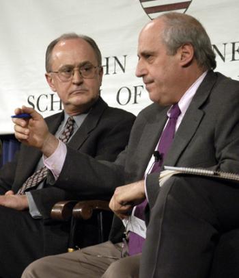 Hours away from the official outbreak of military action, former Assistant Secretary-General of the U.N. JOHN RUGGIE (left) and Institute of Politics Director DAN GLICKMAN debate war on Iraq.