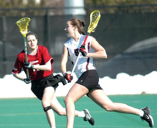 Sophomore attack CASEY OWENS (R) scored a goal against California in the Harvard women's lacrosse team's 7-6 loss.