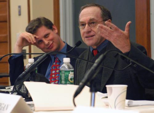 Frankfurter Professor of Law ALAN M. DERSHOWITZ, right, and UCLA law professor EUGENE VOLOKH debate the role of gun control and the Second Amendment at the Law School yesterday.