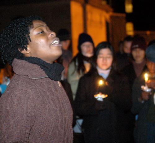 IYEOKA OKOAWO recites poetry at a candlelight vigil in front of Widener Library last night.  The vigil was part of 'Take Back the Night' week, which ends tonight with a benefit concert in Memorial Church.