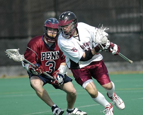 Midfielder DOUG LOGIGIAN (R), shown against Penn, scored two goals as Harvard cut the Tigers’ lead to three late in the game.