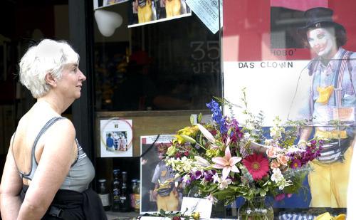 BARBARA LAMB, who offered Perry Rlickman (Perri the Hobo) her basement as a place to stay this winter, looks on at the memorial tribute that celebrated the clown’s life in front of Leo’s Place yesterday.