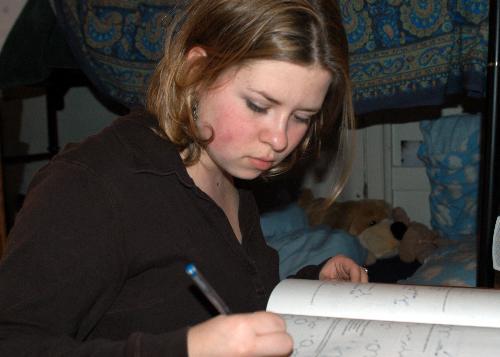 CARRIE E. TUTEN ’04, a biology concentrator, works on a problem set at her desk. She said she is not pre-med but hopes to attend medical school someday.