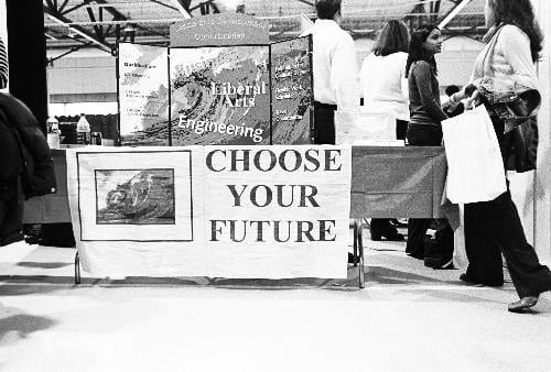 Students browse employment options during the annual OCS Career Fair last October. The fewer freebies at the fair went hand-in-hand with the decline in high-flying jobs that students snatched up when the class entered.