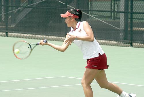 The Harvard women’s tennis team, including freshman EVA WANG, top, celebrates its win over Oklahoma State in the first round of NCAAs, held at the Beren Tennis Center. The Crimson won 4-1 and proceeded to beat Arizona 4-3 the following day.
