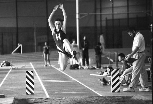Senior ALAYNA MILLER, bottom, takes off during Harvard’s indoor track and field season. The women’s indoor team finished with a third-place finish at HEPS while the men took eighth.