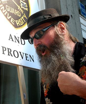 DANNY MEAGHER, vice president of the Harvard University Security, Parking and Museum Guards Union (HUSPMGU) addressed a rally protesting the outsourcing of guard positions. See story, page 3.
