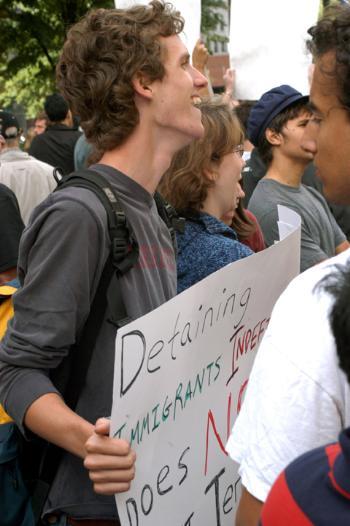 MAX ROGOSKI '07 stands outside of Faneuil Hall with a group of about 20 fellow Harvard protesters.