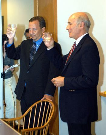 University President LAWRENCE H. SUMMERS and Kenndy School Dean JOSEPH S. NYE share a toast after the announcement.