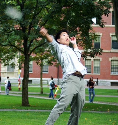 BRIAN B. LIAU ’07 takes a swing in a game of badminton outside of Hollis yesterday afternoon.