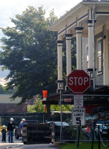 The 162-year-old, 200-ton Palfrey House was hoisted onto a hydraulic system and pulled to its new location on Hammond St. atop a five-story underground parking garage.