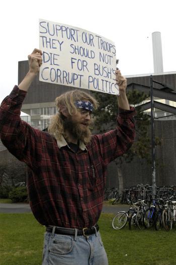 GSAS student TRYGVE RISTROPH urges the withdrawal of troops from Iraq in a protest outside the Science Center yesterday.