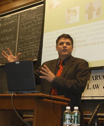 Darl C. McBride, President and CEO of The SCO Group, the company targeted by the MyDoom virus, speaks about intellectual property at the Law School on Monday.