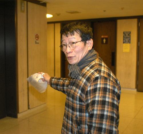 Louie’s owner Cheng-San Chen leaves a hearing at the Cambridge District Court yesterday. Chen will not go to jail but may lose his license for up to six months. 
