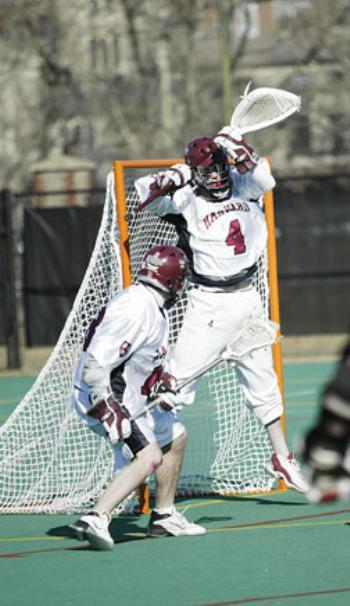 Senior goaltender Jake McKenna, shown in previous action, had 15 saves in Harvard's 11-7 win.