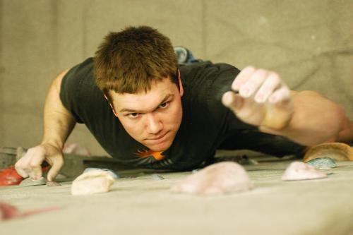 Second-year Harvard Law School student Micah B. May competes in the third annual MIT Bouldering Competition.