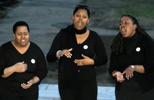 Members of the Sisters of Kuumba gather on the steps of Memorial Church last night to commemorate victims of sexual assault in a ceremony that was part of Take Back the Night week.