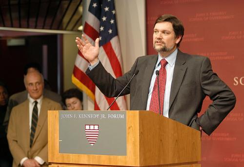 As outgoing Dean of the Kennedy School of Government Joseph S. Nye looks on, Black Professor of Political Economy David T. Ellwood ’75 accepts his new position as KSG dean.