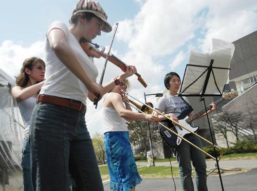 Rebecca E. Wexler ’05, foreground, Miriam D. Lense ’05, left, Anna R. Rosenblum ’06, center, and Christine S. Kim ’06, right, of the musical group Recklez perform klezmer music at IsraelFest yesterday.