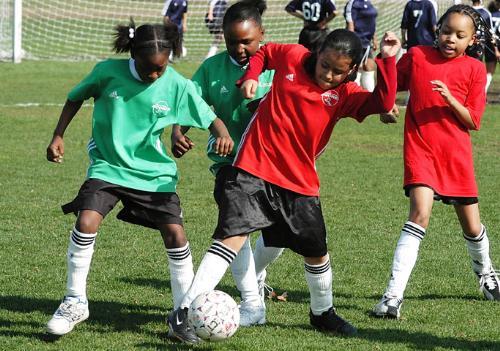 The Harvard men’s and women’s soccer teams helped teach Boston area children involved with the New England SCORES program about soccer yesterday afternoon.