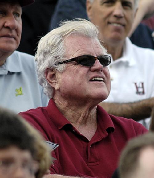 Kennedy keeps his eye on the ball at a Harvard-Dartmouth football game.