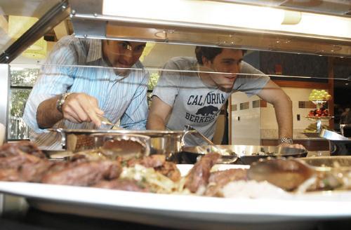 Benjamin R. Robbins ’06 and Jonathan A. Blazek ’06 serve themselves dinner yesterday in the Quincy House dining hall, which opened for its first meal after summer renovations. Please see story, page 3.