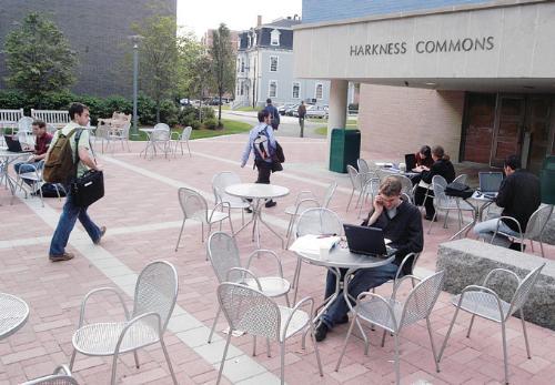 Law School students come and go from the newly-renovated Harkness Commons, their social space equivalent to Loker Commons, yesterday afternoon. Summertime renovations included an expanded lounge and new furniture.