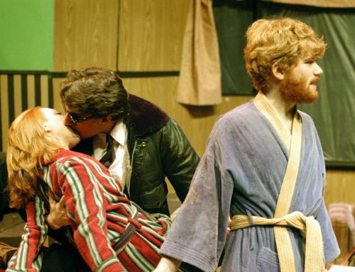 Et (Alex S. Glasser ’06) embraces Maureen (Andrea Spillman ’07) while her Vietnam veteran husband Davy (Abe Riesman ’08) looks on apathetically.